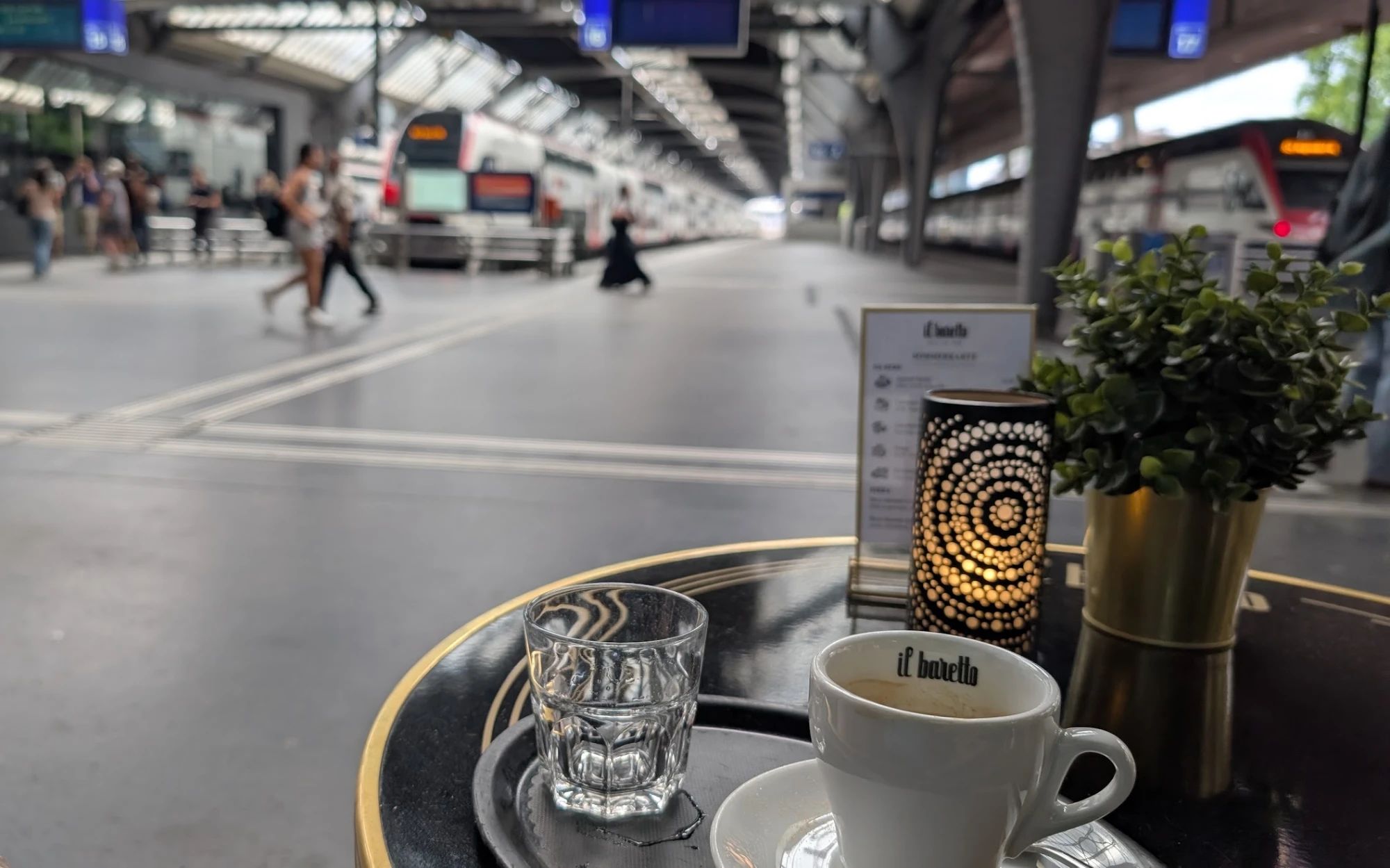 Espresso at a café table on the platforms of Zürich Hauptbahnhof
